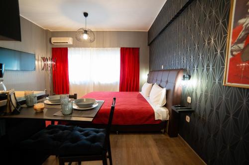 Una cama o camas en una habitación de MARGARITA'S SUITES