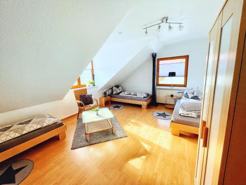 a living room with two beds and a table at Elbinger Str. 28 in Hildesheim