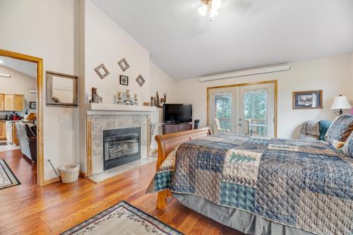 a bedroom with a bed and a fireplace at Cliffview Cabin in Nemo