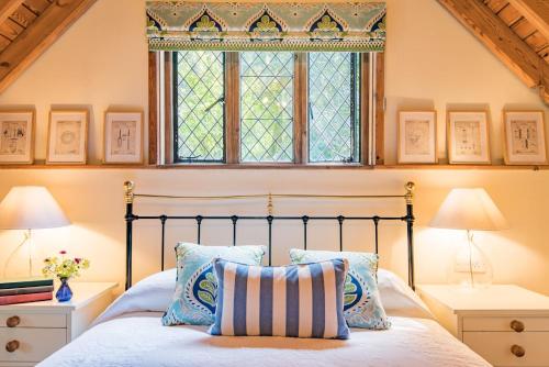 a bedroom with a bed and a window at The Gate House by Bloom Stays in Folkestone