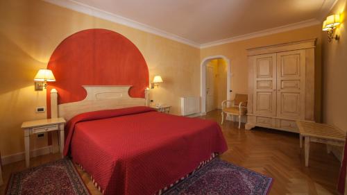 Postel nebo postele na pokoji v ubytování Hotel Cannero