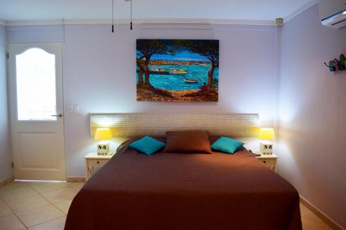 Ліжко або ліжка в номері Oceanfront Barracuda at Den Laman