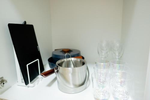 a bucket on a counter next to glasses at Lake Toya and Nakajima in Lake Toya