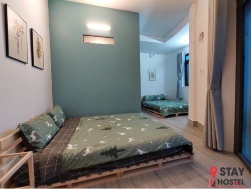 a room with two beds in a room at STAY hostel - 300m from the ferry in Rạch Giá