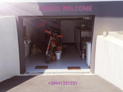 a garage with a motorcycle parked inside of it at Apartment Sunset in Maribor