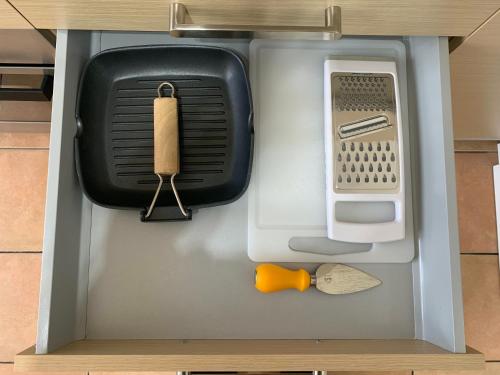 a model of a kitchen with a utensil in it at Appartamento Laura in Merano