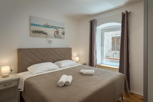 Postel nebo postele na pokoji v ubytování Deluxe Apartment Antonija