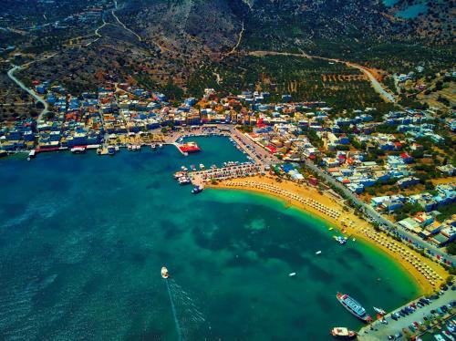 an aerial view of a harbor with boats in the water at Kalypso Suites Hotel - Adults Only in Elounda