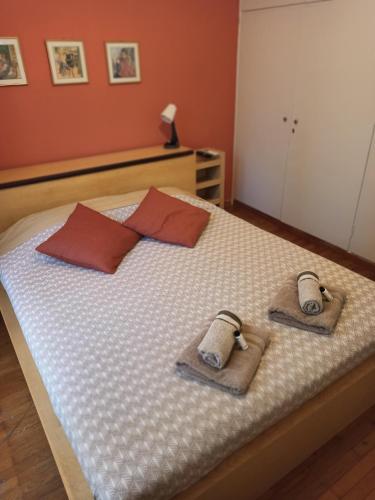 a bedroom with a bed with towels on it at A&F ioannina apartment in Ioannina