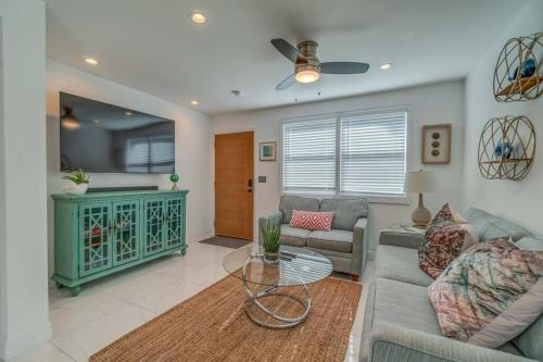 a living room with a couch and a table at Casa Stellata downtown Sarasota 3 Blocks to Bay in Sarasota