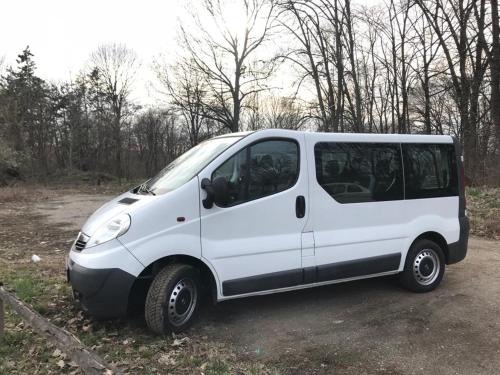 a small white van parked in a field at House Reko in Novi Grad