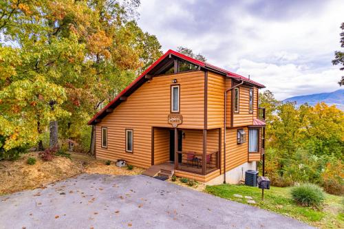 a cabin in the woods with a driveway at Twinflower Summit - Incredible views, pet friendly! in Gatlinburg