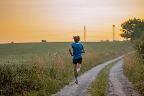 a man running down a dirt road at Dom na Mazurach Gąsiorowo in Purda