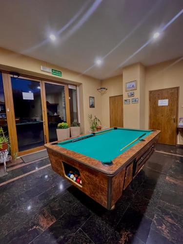 a pool table in a room with a pool table at Titanic in Władysławowo