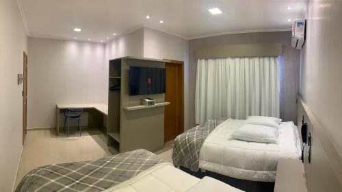 Ένα ή περισσότερα κρεβάτια σε δωμάτιο στο Hotel Villa Inácia
