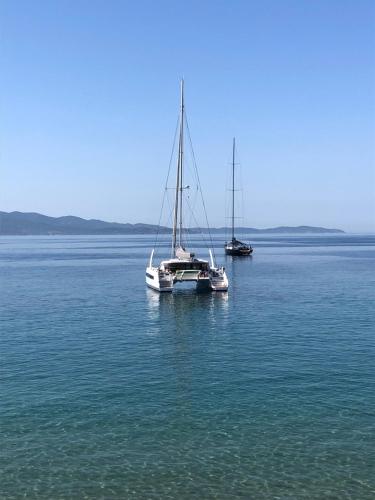 two boats sitting in the middle of the water at Ajaccio : appartement centre historique in Ajaccio