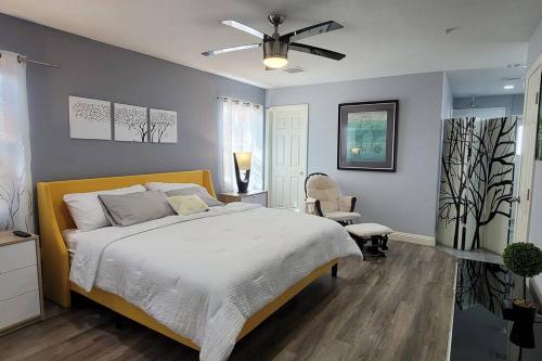 a bedroom with a bed and a ceiling fan at K - Fully remodeled and professionally decorated in Las Vegas