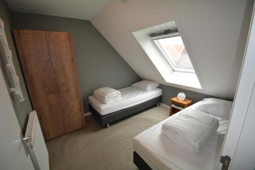Ένα ή περισσότερα κρεβάτια σε δωμάτιο στο Duinpan