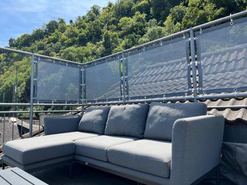 a couch sitting on top of a balcony at Ferienwohnung "drei Burgen Blick" in Sankt Goar