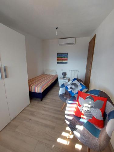 Postel nebo postele na pokoji v ubytování Attico Panoramico Baunei