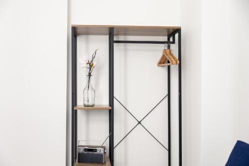 a sliding glass door with a shelf at Apartments am Neuen Theater - Altstadt - Zentral - Küche - Wifi - Powered by Ko-Living in Halle an der Saale