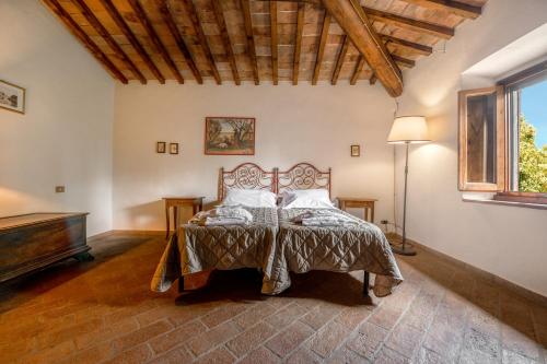 a bedroom with a bed and a piano at Podere Mezzastrada - Place of Charme in Fiano