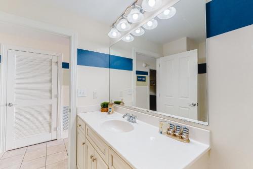 a bathroom with a sink and a mirror at Belmont Towers 505 in Ocean City