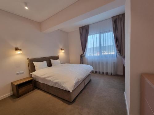 Postel nebo postele na pokoji v ubytování Apartament in complex rezidențial