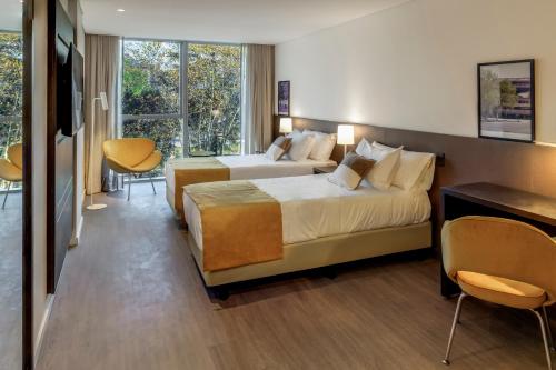 Кровать или кровати в номере Dazzler by Wyndham La Plata