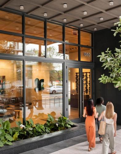 two women walking outside of a building at ROOST Tampa in Tampa