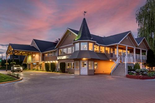 a large house with a church at Best Western Inn at Penticton in Penticton