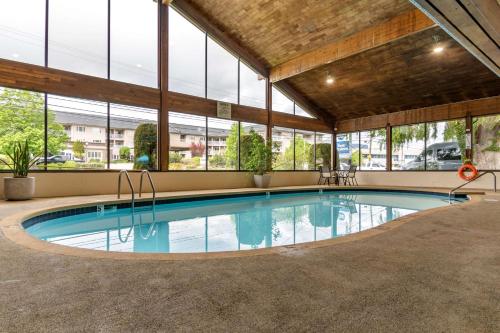 a swimming pool in a building with windows at Best Western Inn at Penticton in Penticton