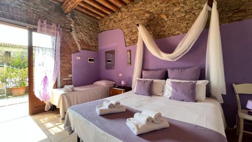 A bed or beds in a room at Agriturismo Le Biricoccole