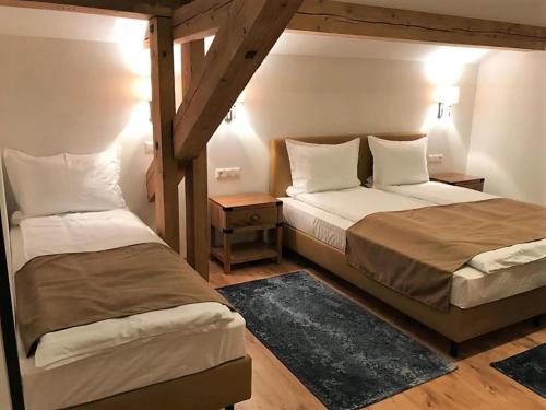 Haus Planegg XL tesisinde bir odada yatak veya yataklar