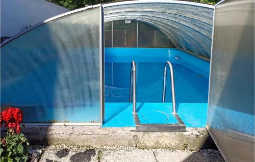 a swimming pool inside of a dome shaped building at 2 Bedroom Lovely Home In Badersleben in Badersleben