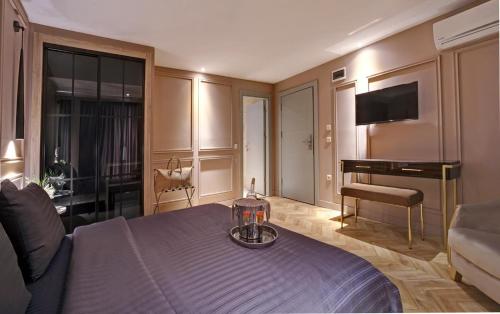 a hotel room with a bed and a piano at Concept Nisantasi Hotels & Spa in Istanbul