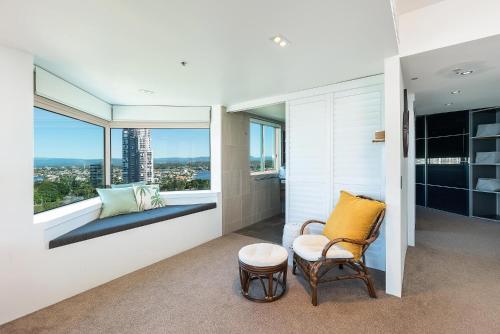 a room with a chair and a window at The Waterford on Main Beach in Gold Coast