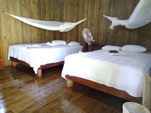 En eller flere senge i et værelse på Casa Maya