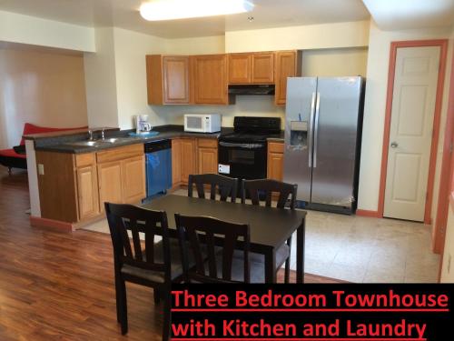 a kitchen with a three bedroom townhouse with kitchen and laundry at Stay Vacation Homes Niagara Falls in Niagara Falls