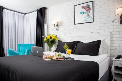 Katil atau katil-katil dalam bilik di Check Inn Suite Hotel & SPA