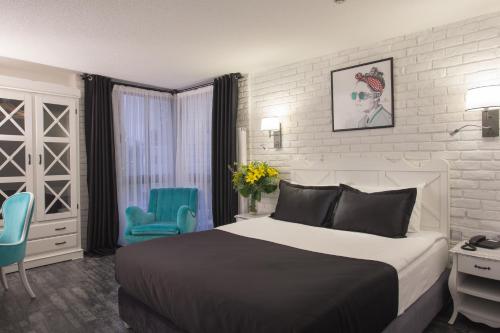 Katil atau katil-katil dalam bilik di Check Inn Suite Hotel & SPA