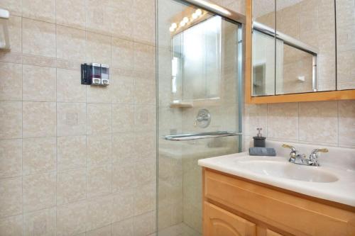 a bathroom with a sink and a shower at Hollywood Oasis: Lovely Studio with Free Parking in Hollywood