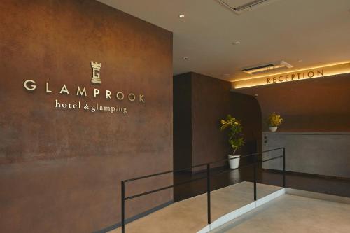 a lobby with a staircase in a building at Glamprook Shimanami in Imabari