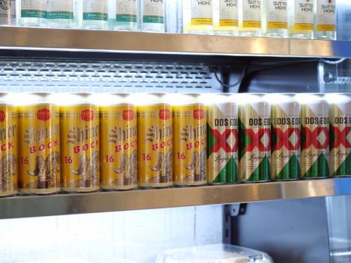 a row of cans of food on a shelf at The Crockett Hotel in San Antonio