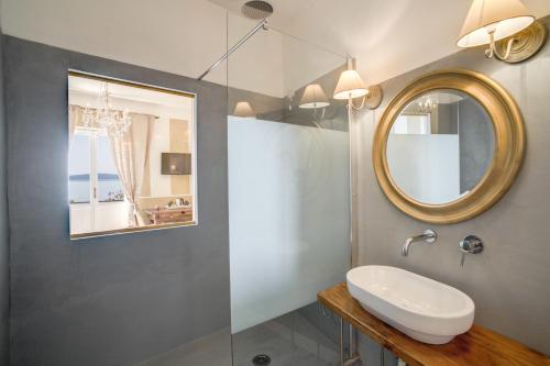 a bathroom with a sink and a mirror at Hotel Borgo Vistalago in Trevignano Romano
