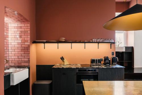 a kitchen with a counter top and a sink at Miss Midgley's - Locker Room in Brisbane