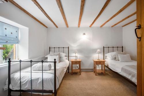 Ένα ή περισσότερα κρεβάτια σε δωμάτιο στο Meadow Brook Cottage