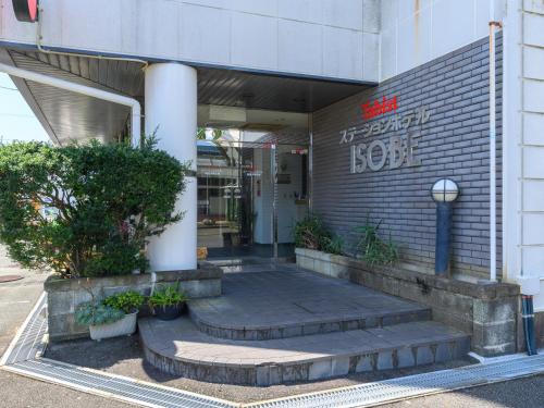 an entrance to a building with stairs in front at Tabist Station Hotel Isobe Ise-Shima in Shima