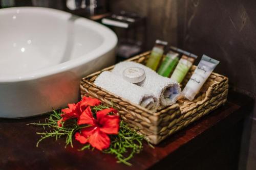 a basket of towels and towels on a table in a bathroom at Platinum Cawa Apartments in Nadi