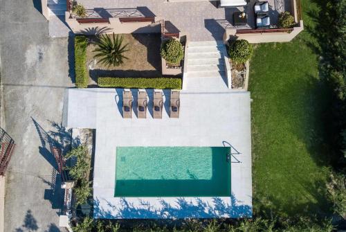 an aerial view of a house with a swimming pool at Muses villa in Pastida